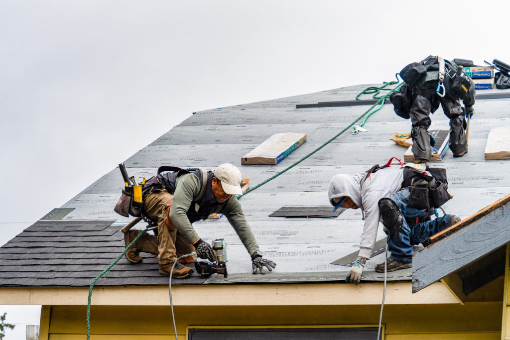 Roofers working on reroof project